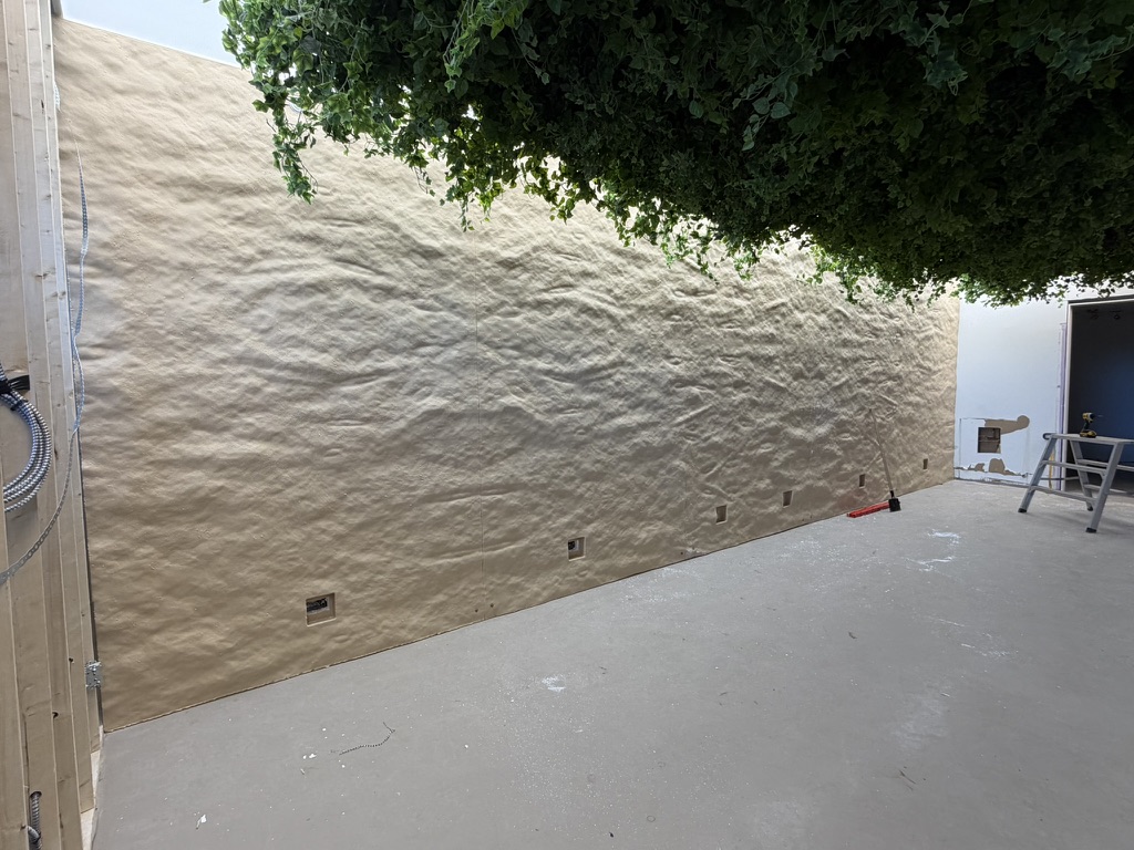 Textured wall panels during installation